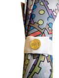 Luxury slim umbrella with pastel chain canopy design, elegant black frame and striking gold handle by David David, a fashion accessories brand and print studio based in London England, specialising in bold geometric print