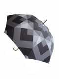 Luxury slim umbrella with stunning monochrome canopy design, elegant black frame and striking gold handle by David David, a fashion accessories brand and print studio based in London England, specialising in bold geometric print