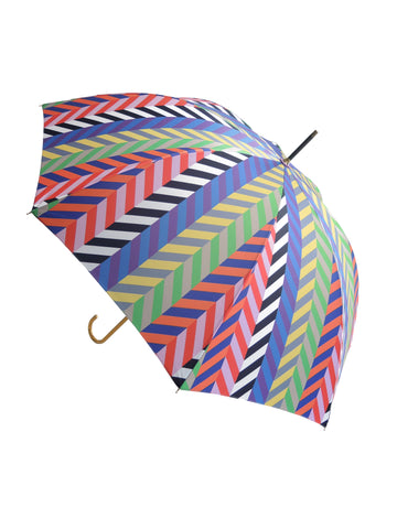Luxury slim umbrella with bright chevron print, elegant black frame and striking gold handle by David David, a fashion accessories brand and print studio based in London England, specialising in bold geometric print