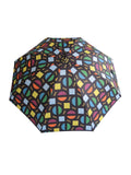 Luxury slim umbrella with bright roundel print, elegant black frame and striking gold handle by David David, a fashion accessories brand and print studio based in London England, specialising in bold geometric print