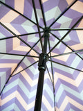 Luxury slim umbrella with jewel chevron canopy design, elegant black frame and striking gold handle by David David, a fashion accessories brand and print studio based in London England, specialising in bold geometric print