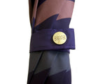 Luxury slim umbrella with jewel chevron canopy design, elegant black frame and striking gold handle by David David, a fashion accessories brand and print studio based in London England, specialising in bold geometric print