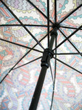 Luxury slim umbrella with pastel chain canopy design, elegant black frame and striking gold handle by David David, a fashion accessories brand and print studio based in London England, specialising in bold geometric print